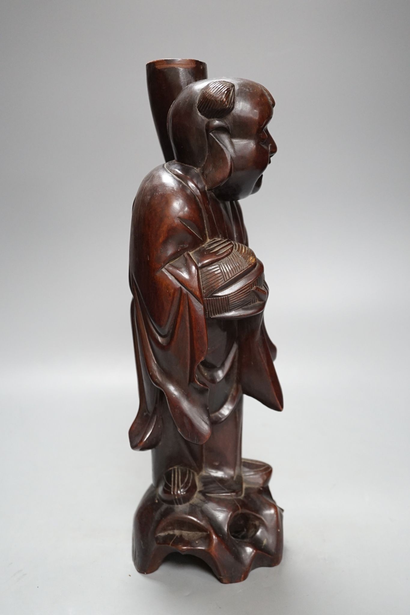 A Chinese hardwood figure of an immortal, 36cm